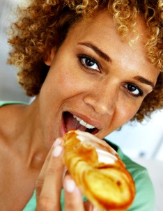 woman eating pastry