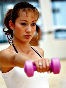 woman exercising with free-weights