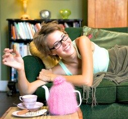 Woman enjoying tea on a couch